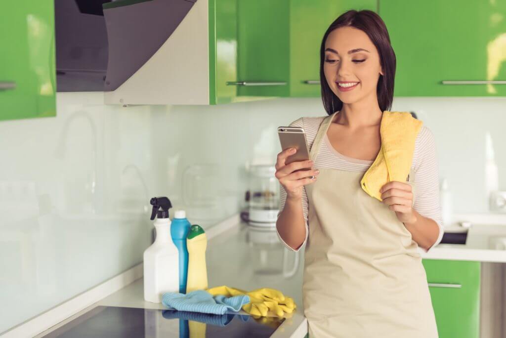 Woman cleaning her kitchen